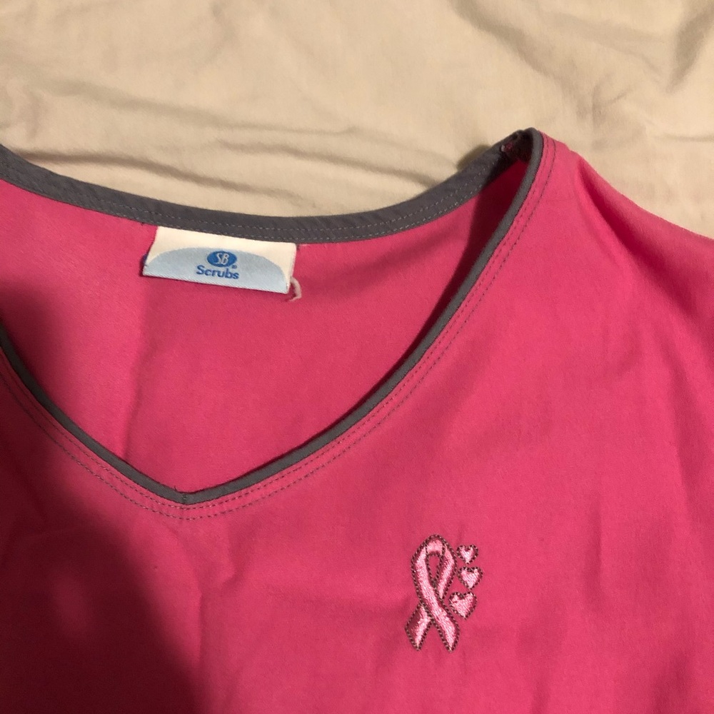 Pink scrub and black pants set